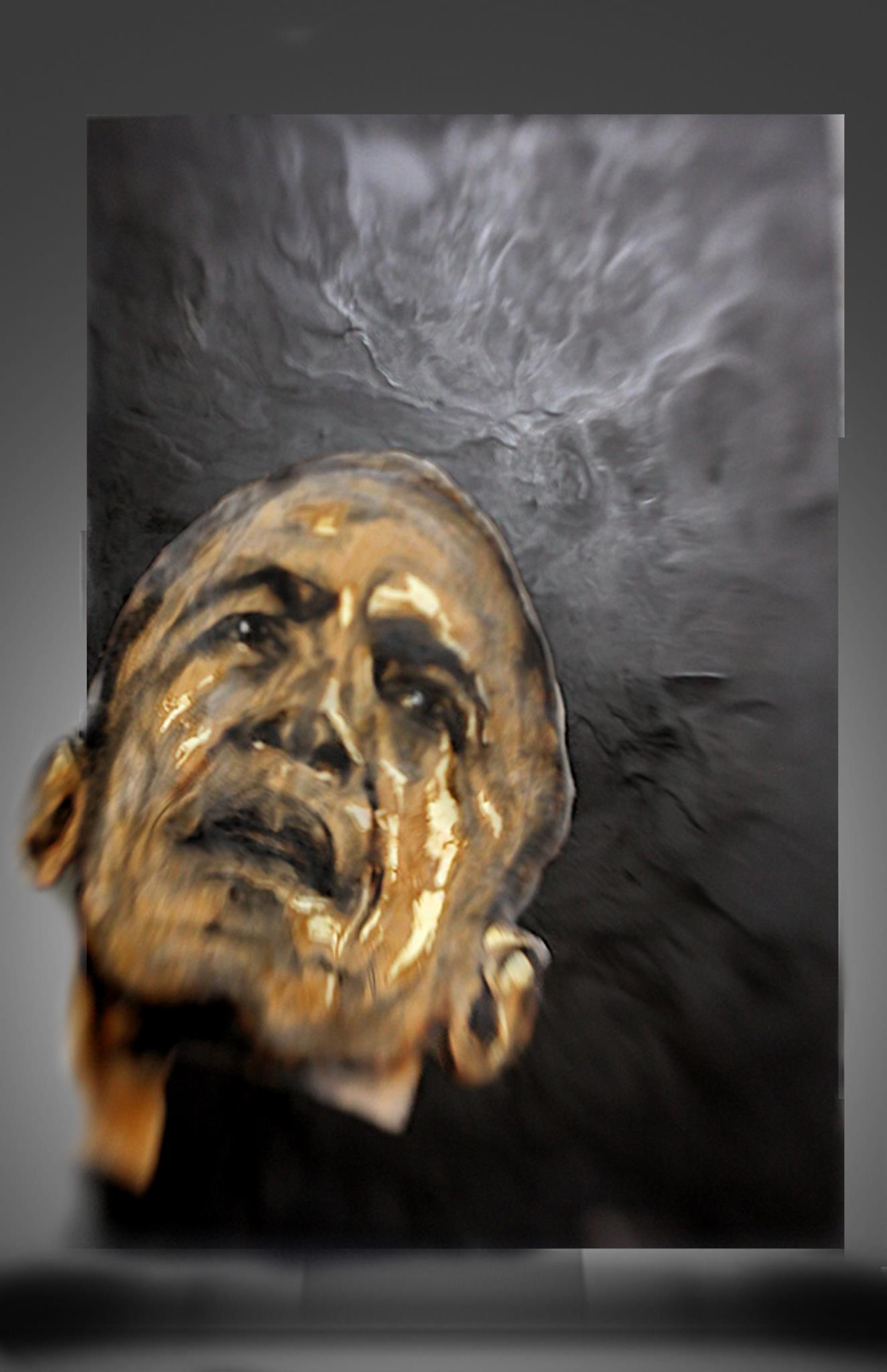 A head painted in gold and black on a dark reticulated ground