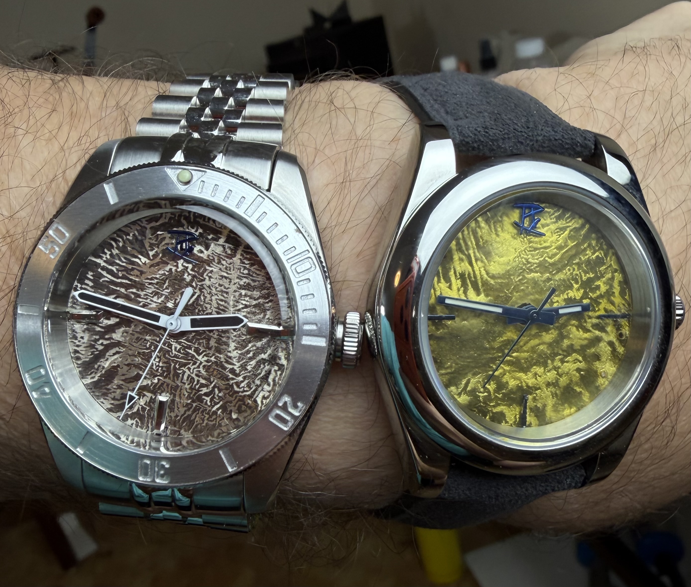 Two reticulated dials worn side by side — one bronze, one bright citron