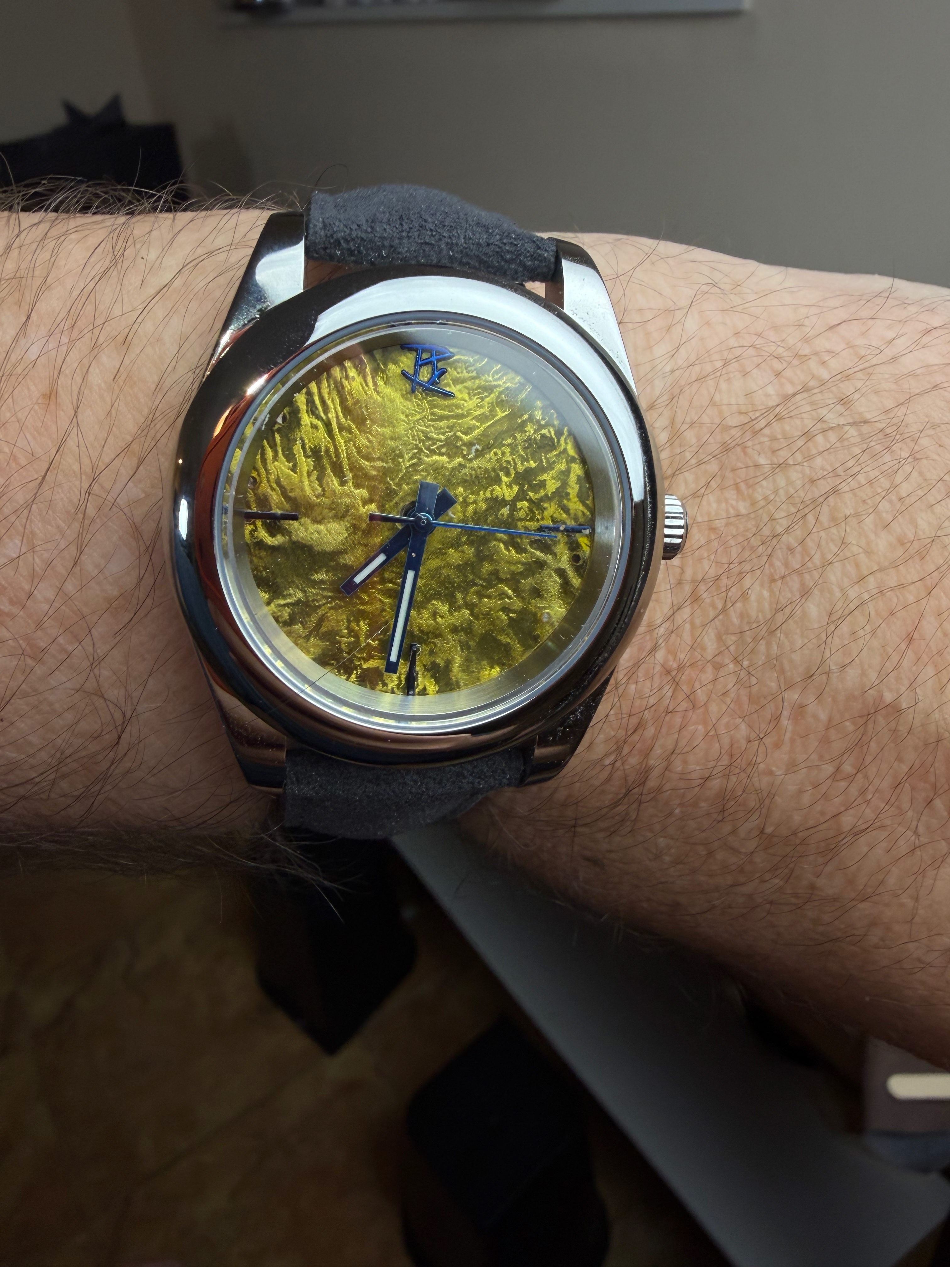 A gold reticulated dial worn indoors